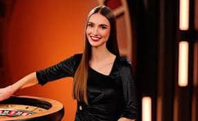 qplay88 live-dealer studio showing professional dealers and multi-camera setup